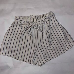 White and navy blue striped paper bag shorts